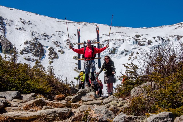 Bo Adams at Tuckerman's ravine, holding skis and poles